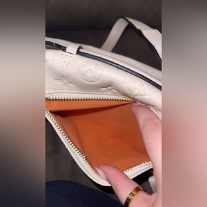 Cream Louis Vuitton bum bag